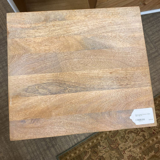 Wooden floor sample with a visible brand label on a carpeted floor