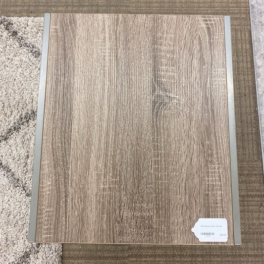 Wooden panel with a label on a textured surface