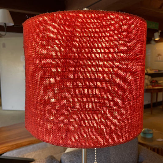 Red textured lampshade in a room setting
