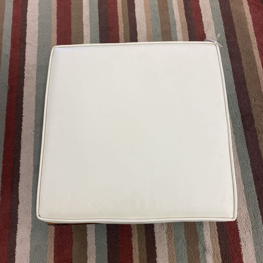 White cushion on a striped fabric background