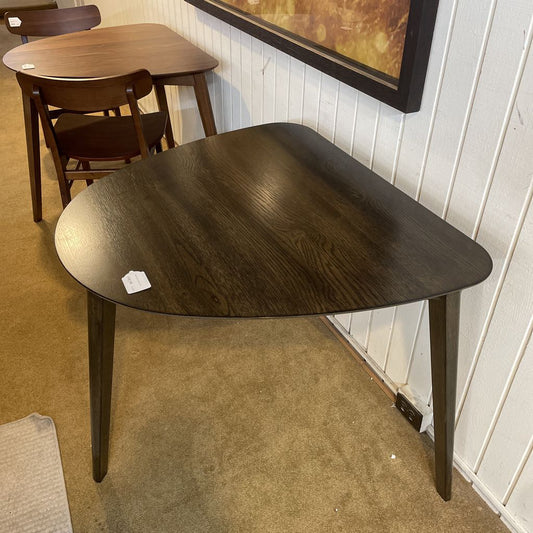 Dark wooden table with a plain background