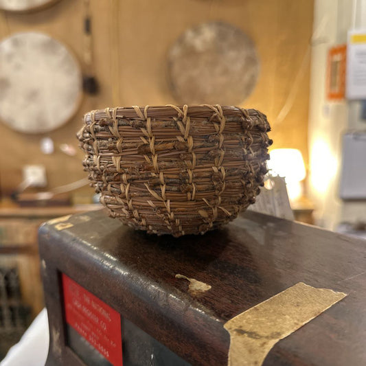 Woven basket on a wooden surface with a blurred background