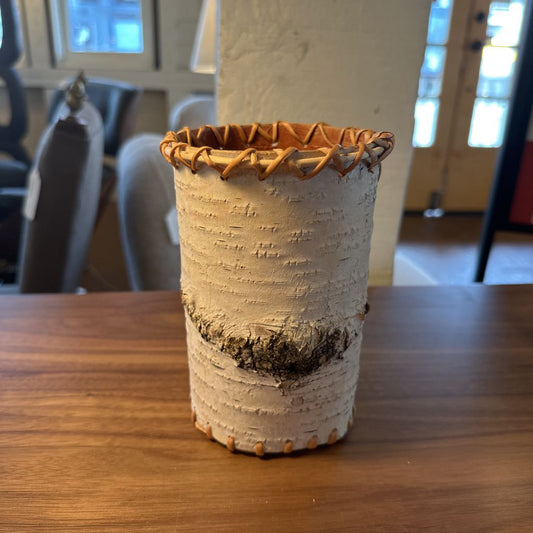 Ceramic vase with textured surface on a wooden table