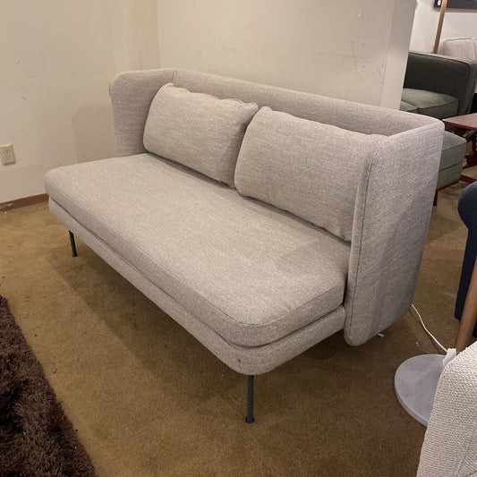 Gray sofa in a room with a neutral color scheme
