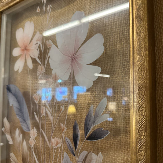 Decorative glass panel with floral design and gold frame