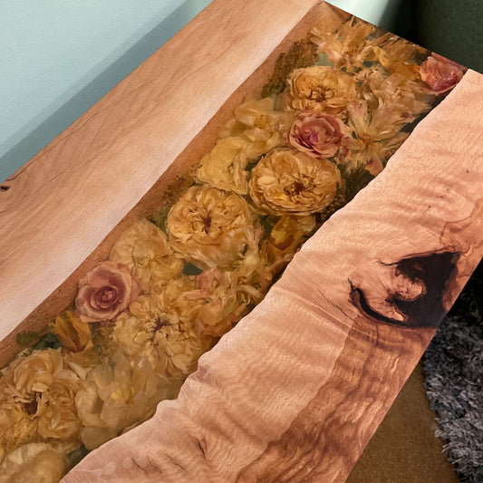 Wooden table with floral design embedded in the surface