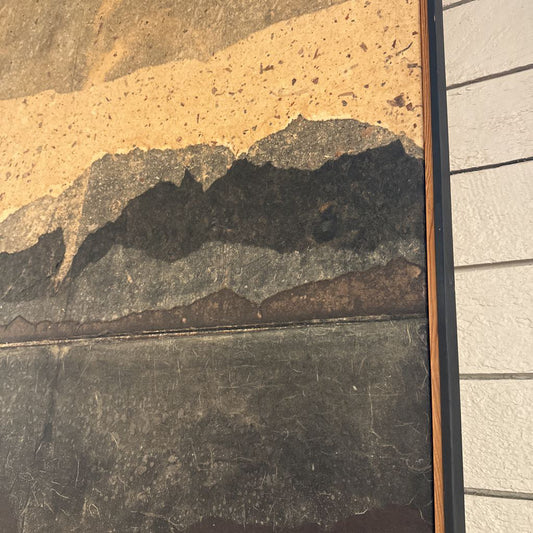 Close-up of a textured wall with a mix of colors and patterns.