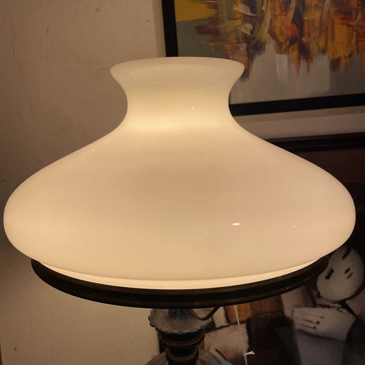 White lampshade on a stand with a blurred background