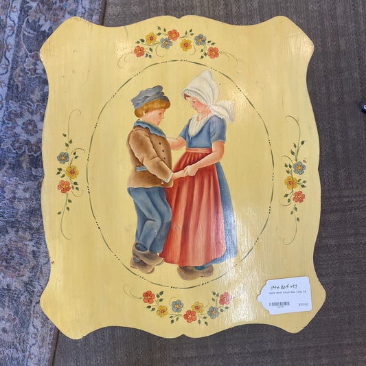 Decorative panel with a painting of two people shaking hands on a textured surface