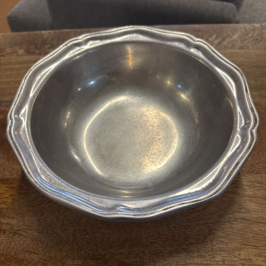 Silver bowl on a wooden surface