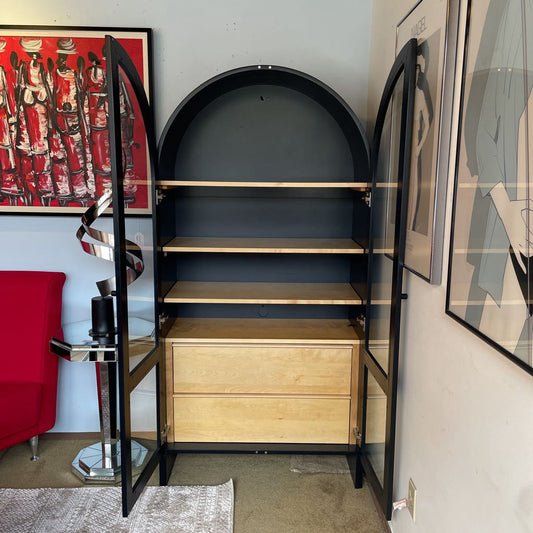 Black Arch Glass Front Cabinet with Light Wood Shelving