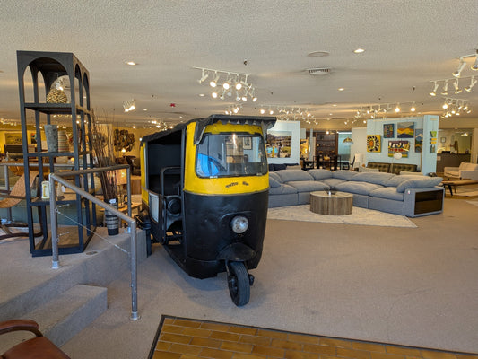 Tuk-tuk car in a showroom