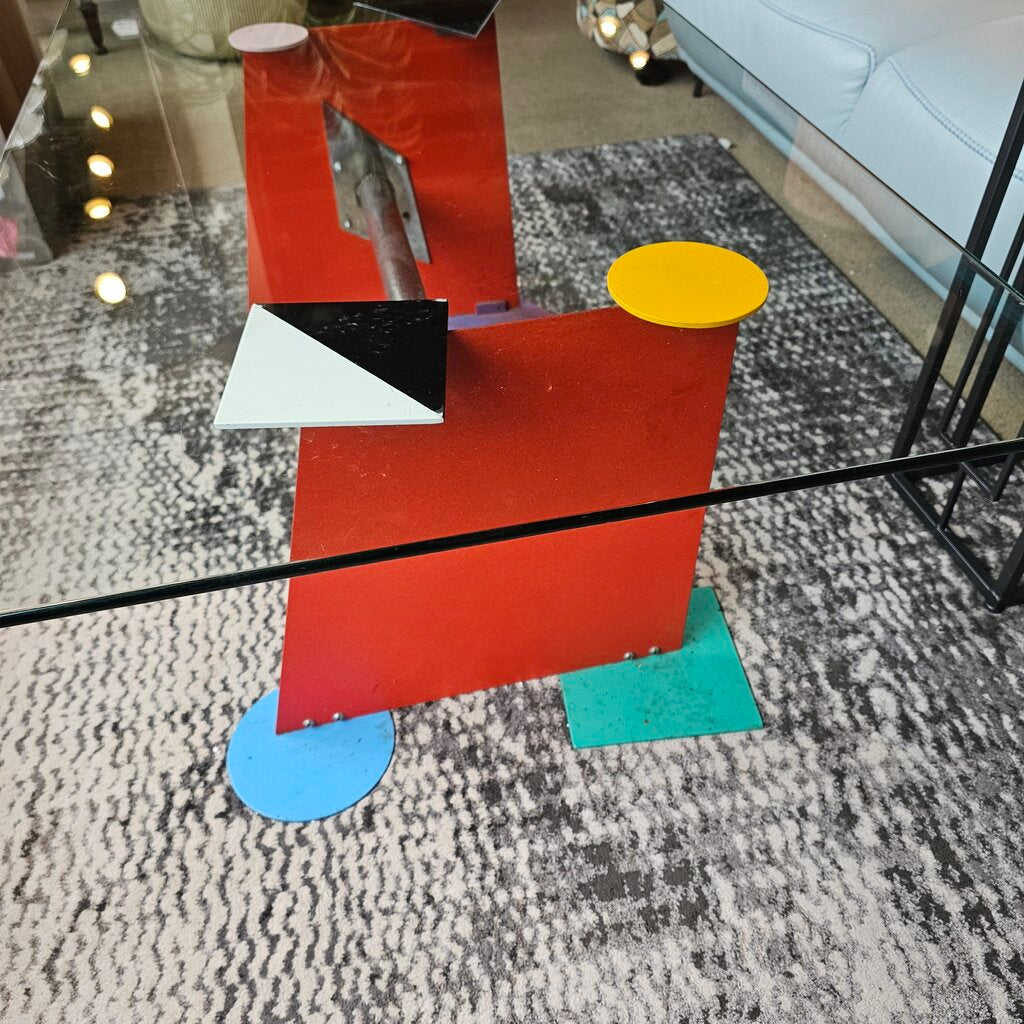 Colorful geometric sculpture on a textured floor