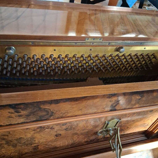 Close-up of an old wooden piano mechanism