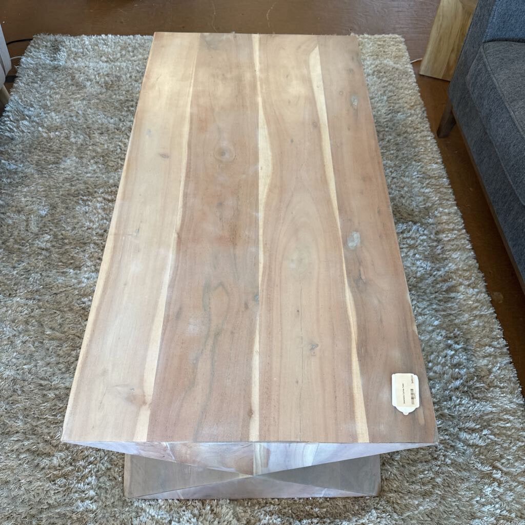 Wooden cutting board on a textured surface