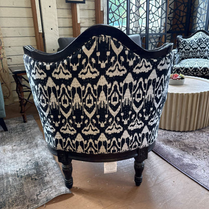 Decorative armchair with black and white pattern in a room setting