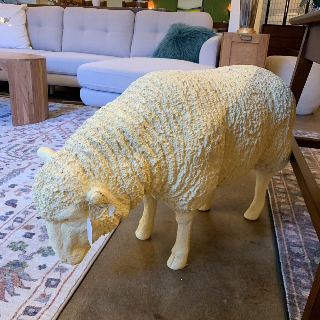 Decorative sheep figure in a living room setting