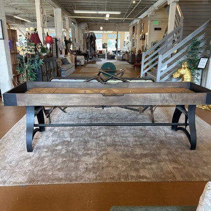 Wooden pool table in a room with furniture and decor