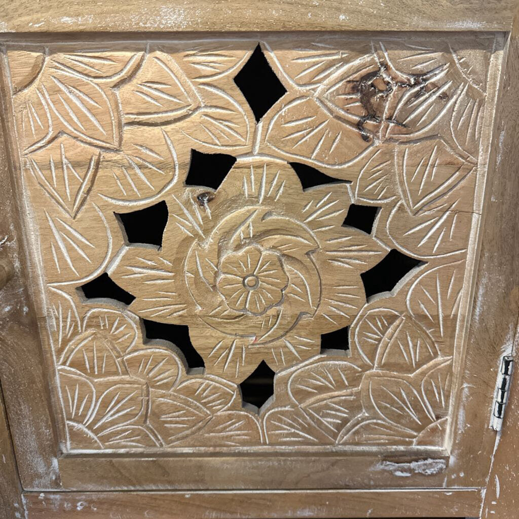 Decorative wooden panel with floral carvings