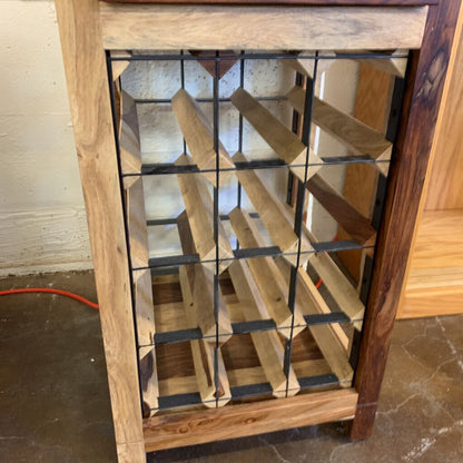 Wooden wine rack with glass panels on a tiled floor.