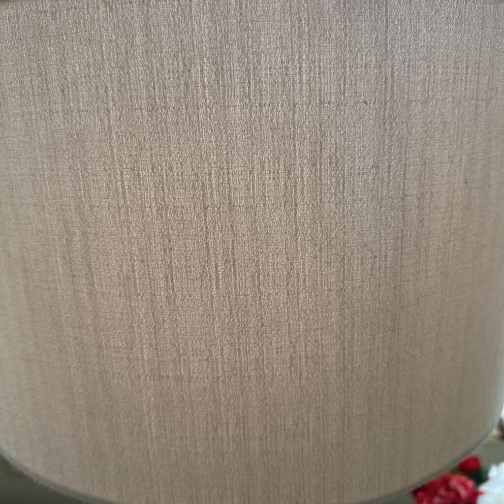 Close-up of a textured beige fabric surface