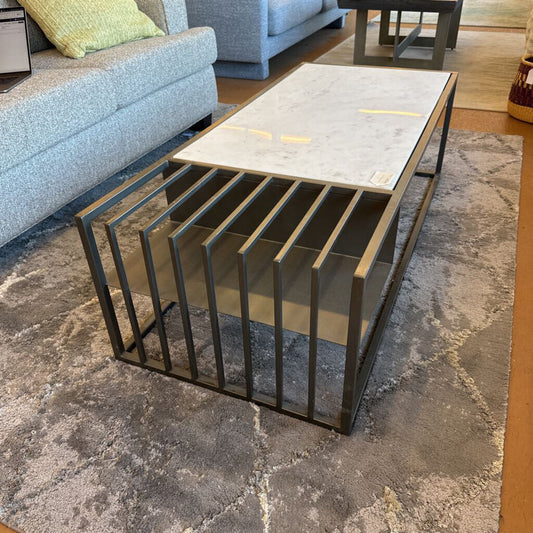 Coffee table with metal frame and marble top in a living room setting