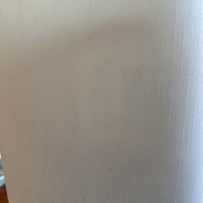 Close-up of a white surface with visible texture
