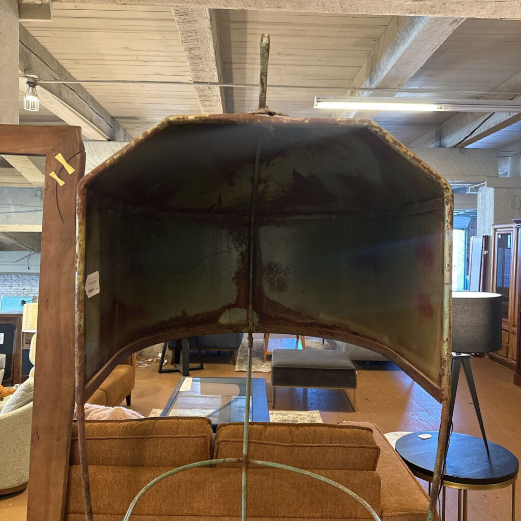 Large decorative mirror with a wooden frame in a room with furniture and decor.