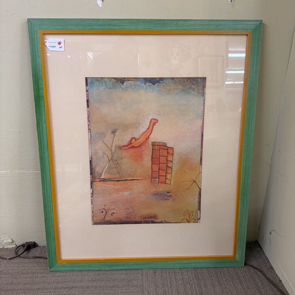 Framed artwork with a colorful abstract design on a plain background