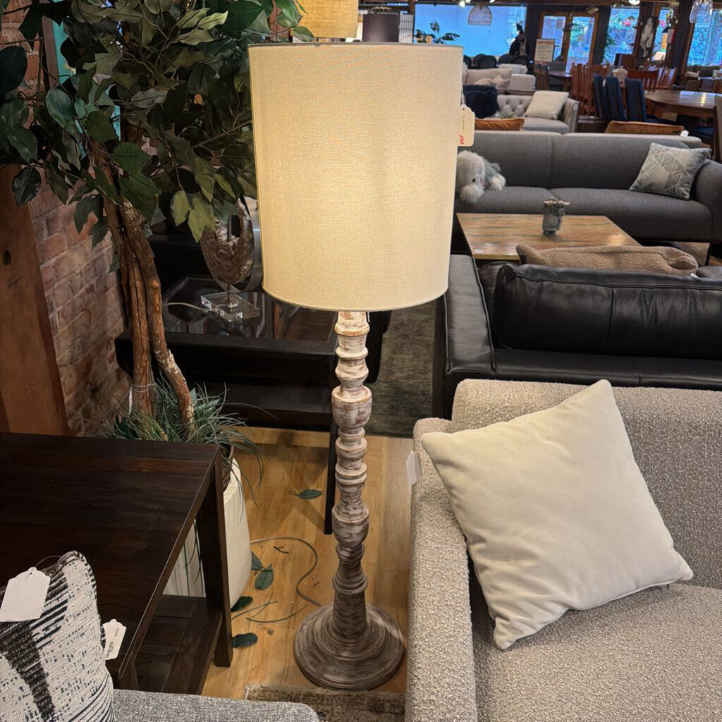 Living room with a lamp, couch, and coffee table