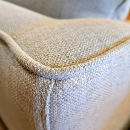 Close-up of a textured beige fabric surface