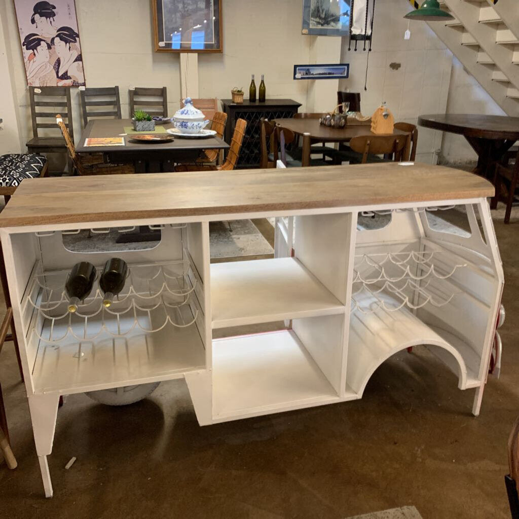 White kitchen island with wooden top in a room setting