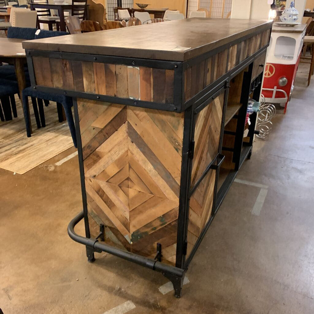 Wooden bar cart with metal accents in a casual indoor setting