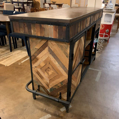 Wooden bar cart with metal accents in a casual indoor setting