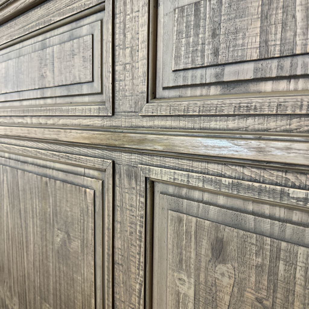 Close-up of wooden paneling with a rustic finish
