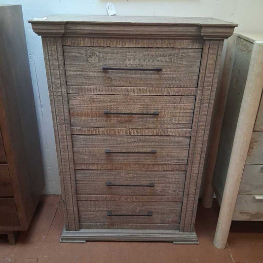 Wooden dresser with four drawers in a room setting