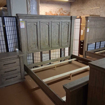 Wooden bed frame with headboard in a store setting