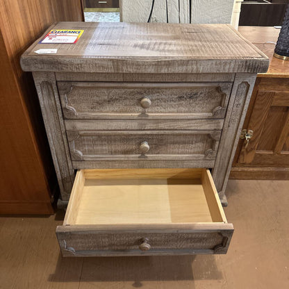 Wooden nightstand with open drawer in a room setting