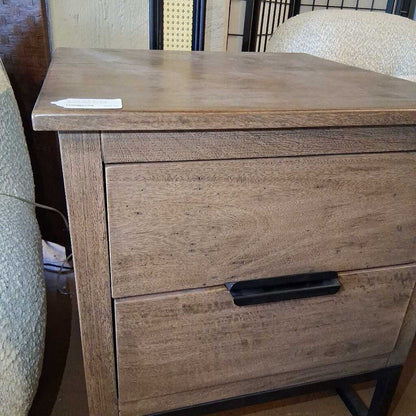 Wooden nightstand with two drawers in a room setting