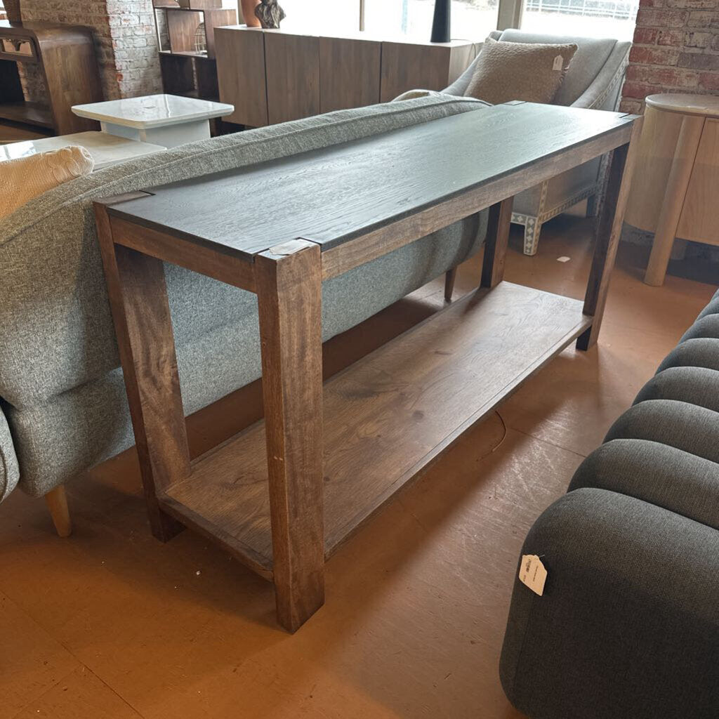 Wooden table with a shelf in a room with furniture and decor