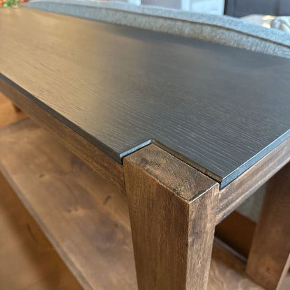 Wooden table with a dark gray top