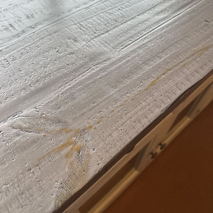 Close-up of a textured surface with a brown stain