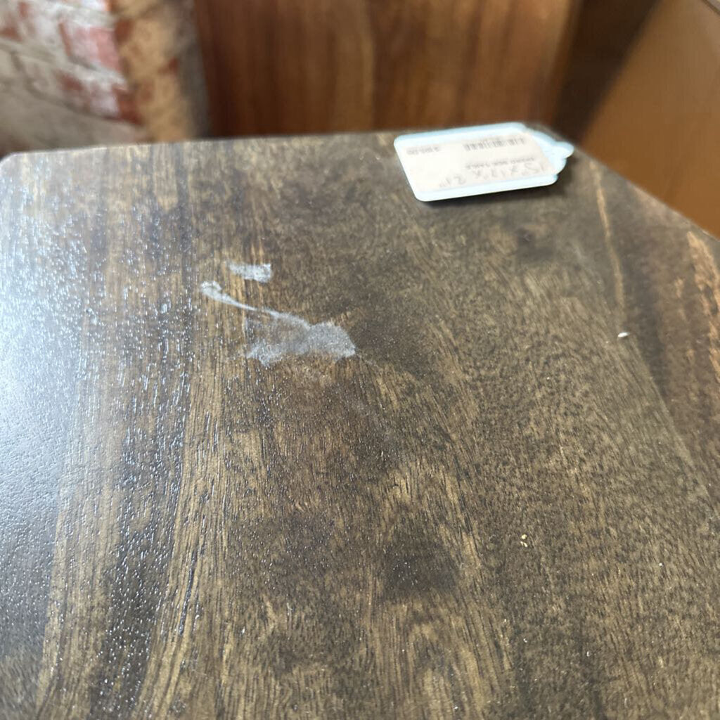 Wooden surface with a label on a blurred background