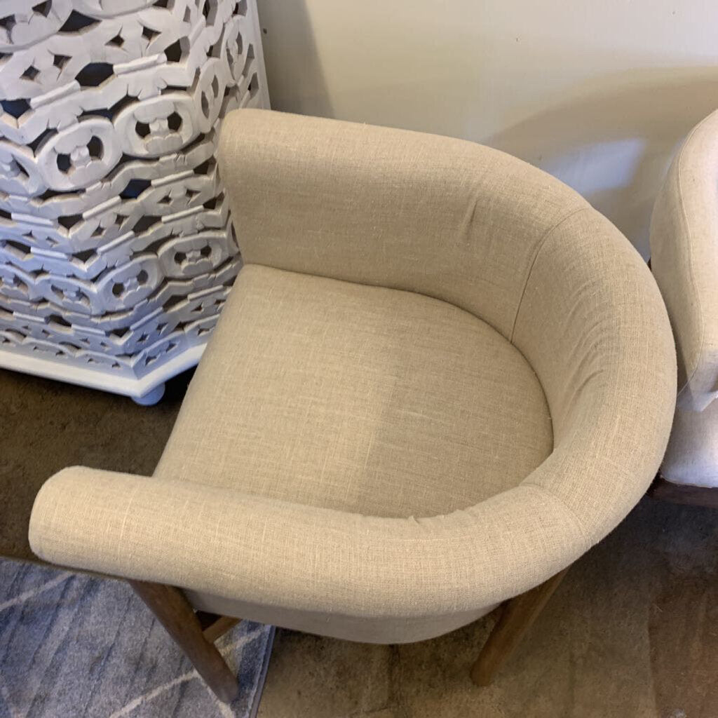 Beige armchair in a room with decorative elements