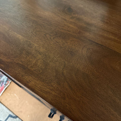 Close-up of a wooden surface with a ruler for scale