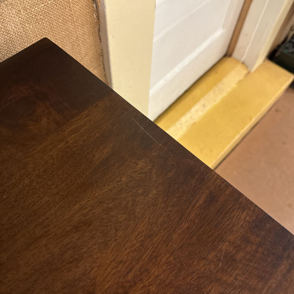 Close-up of a wooden surface with a blurred background