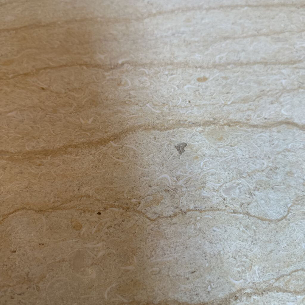 Close-up of beige and brown stone surface
