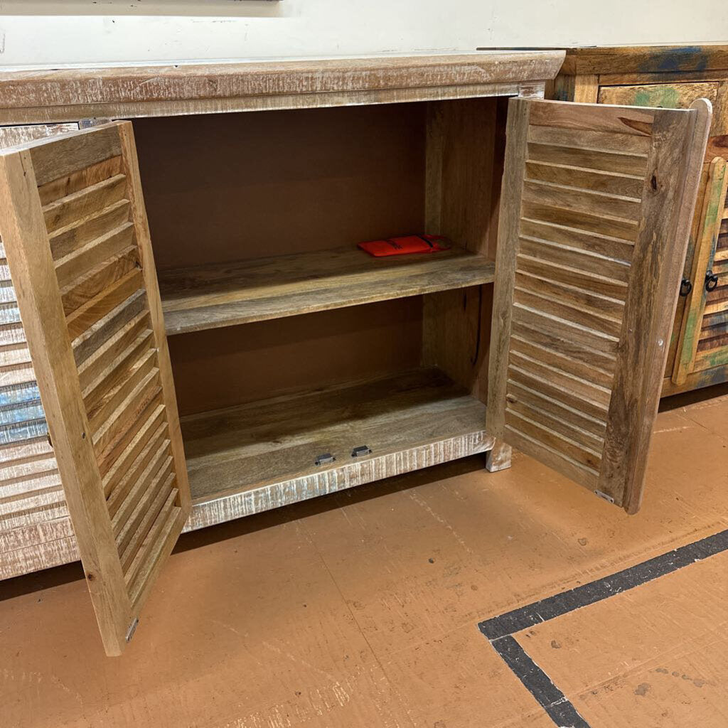 Wooden cabinet with open doors on a wooden floor