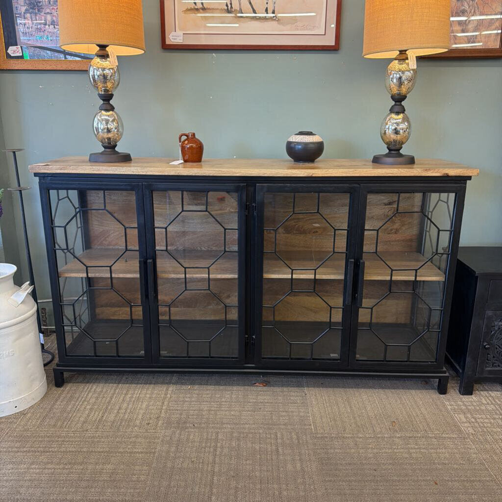 Cabinet with glass doors and wooden top in a room setting