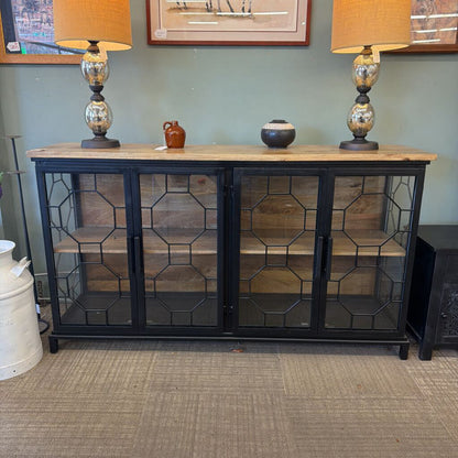 Cabinet with glass doors and wooden top in a room setting